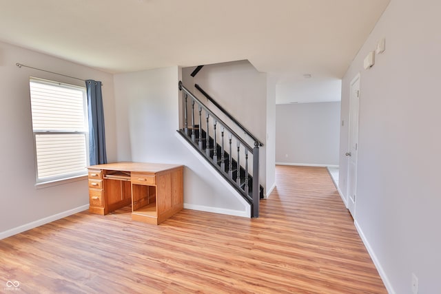 5944 Edelle Dr, Indianapolis, IN 46237 - interior space featuring stairway, baseboards, and light wood-style flooring