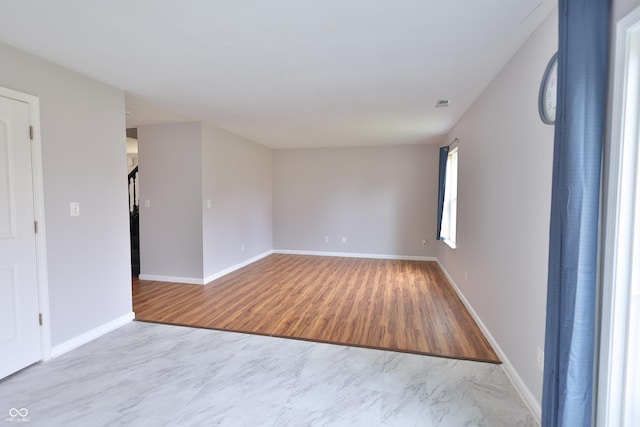 5944 Edelle Dr, Indianapolis, IN 46237 - spare room with visible vents, wood finished floors, and baseboards