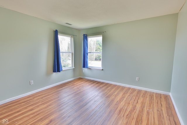 5944 Edelle Dr, Indianapolis, IN 46237 - spare room with visible vents, wood finished floors, and baseboards