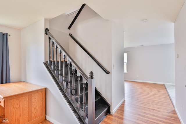5944 Edelle Dr, Indianapolis, IN 46237 - stairway featuring wood finished floors and baseboards
