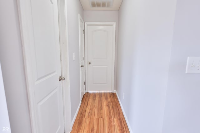 5944 Edelle Dr, Indianapolis, IN 46237 - corridor featuring light wood-style floors, baseboards, and visible vents