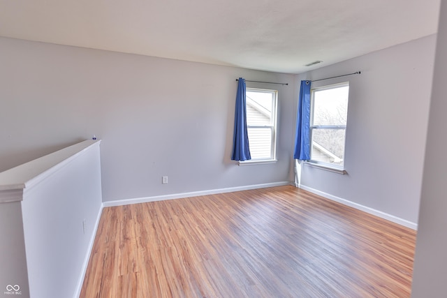 5944 Edelle Dr, Indianapolis, IN 46237 - spare room featuring light wood-style flooring, visible vents, and baseboards