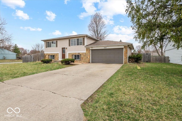 view of front of home with fence, a front yard, a garage, stone siding, and driveway