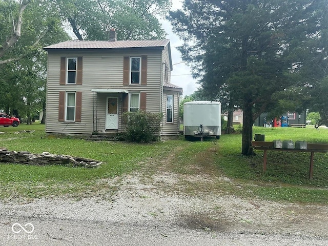 9278 S Geneva Rd, Flat Rock, IN 47234 - traditional home with metal roof and a front lawn