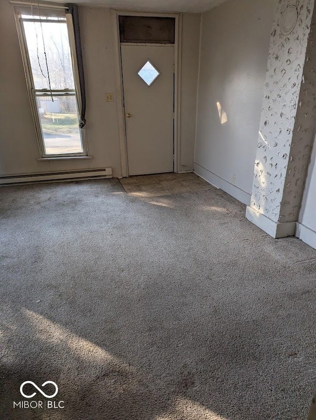 9278 S Geneva Rd, Flat Rock, IN 47234 - foyer featuring a baseboard heating unit