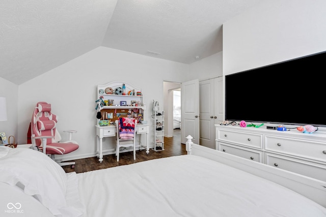 1521 Avondale Dr, Westfield, IN 46074 - bedroom with lofted ceiling, wood finished floors, and a textured ceiling