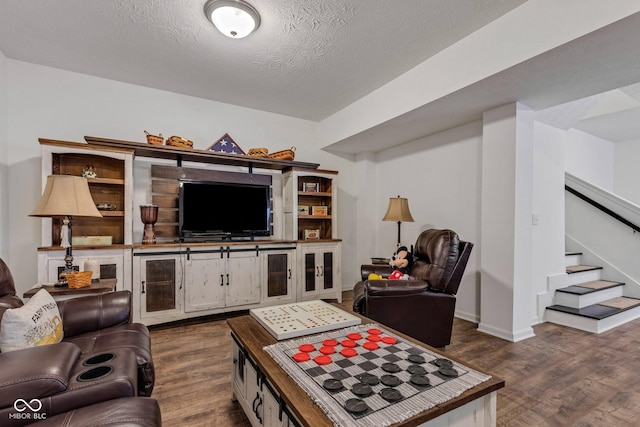 1521 Avondale Dr, Westfield, IN 46074 - living area featuring dark wood-style floors, stairway, a textured ceiling, and baseboards