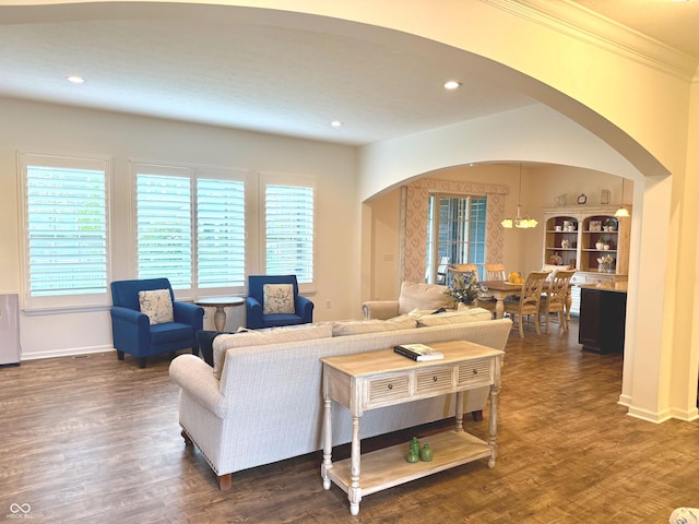1521 Avondale Dr, Westfield, IN 46074 - living area featuring arched walkways, healthy amount of natural light, dark wood finished floors, ornamental molding, and recessed lighting