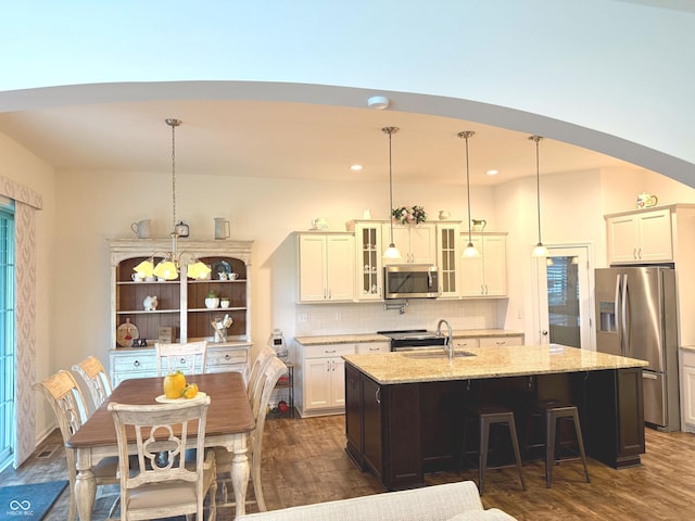 1521 Avondale Dr, Westfield, IN 46074 - kitchen featuring stainless steel appliances, an island with sink, dark wood-type flooring, tasteful backsplash, and recessed lighting