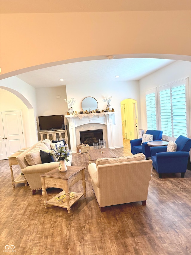 1521 Avondale Dr, Westfield, IN 46074 - living area with arched walkways, wood finished floors, and a tile fireplace