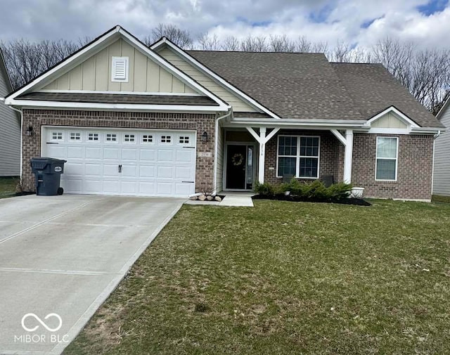 view of front of house featuring an attached garage, a shingled roof, a front lawn, and brick siding