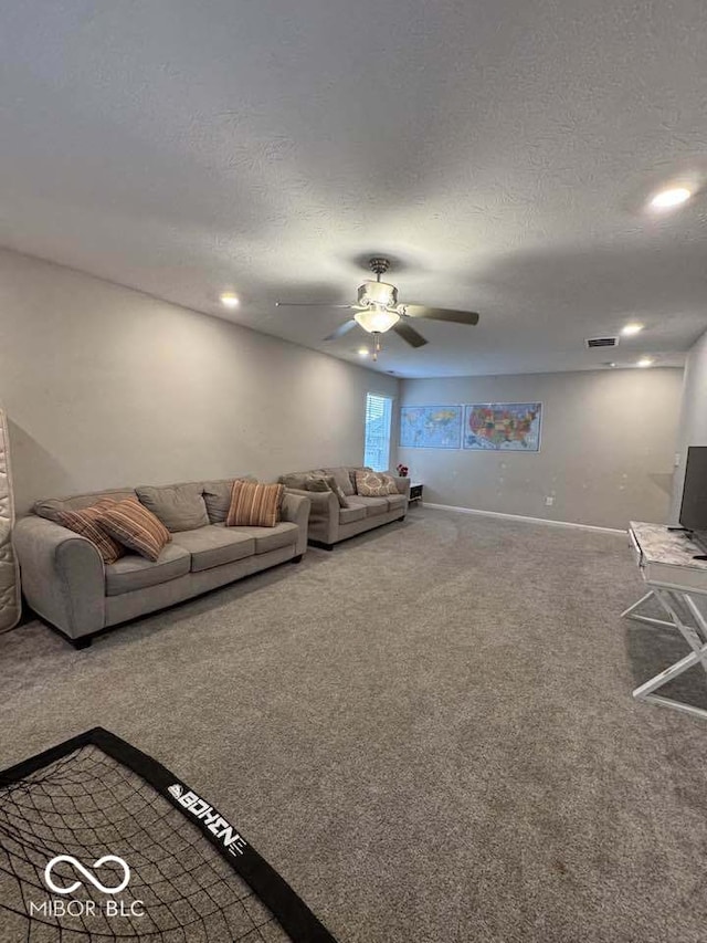 unfurnished living room with a textured ceiling, visible vents, carpet, baseboards, and ceiling fan