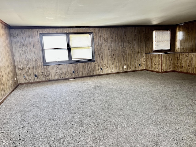 unfurnished room featuring baseboards and carpet floors