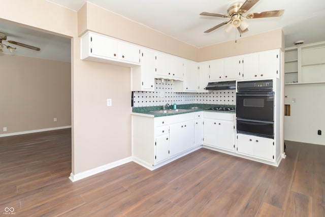 1701 Nelson Ave, Indianapolis, IN 46203 - kitchen featuring a warming drawer, a ceiling fan, stovetop, under cabinet range hood, and black oven