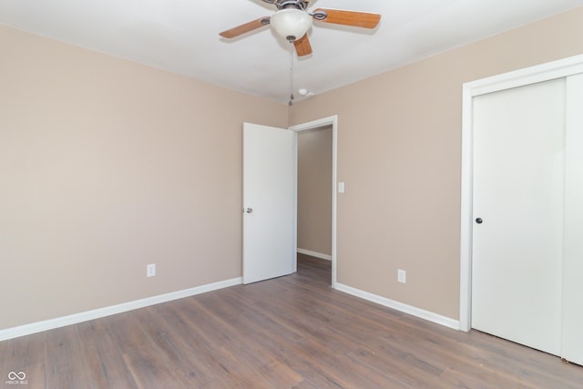 1701 Nelson Ave, Indianapolis, IN 46203 - unfurnished bedroom featuring a ceiling fan, wood finished floors, baseboards, and a closet
