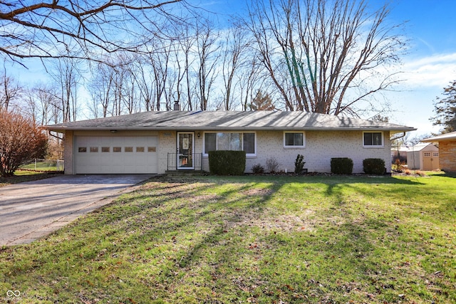7133 Mc Lain Dr, Indianapolis, IN 46217 - single story home featuring a front yard, concrete driveway, brick siding, and a garage