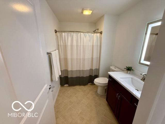 110 E Washington St Unit 802, Indianapolis, IN 46204 - full bath featuring vanity and a shower with shower curtain