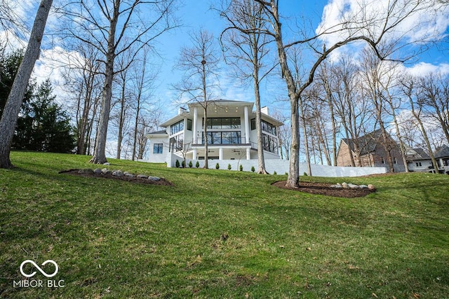 395 Breakwater Dr, Fishers, IN 46037 - view of front of property with stucco siding, a chimney, and a front lawn