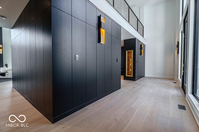 395 Breakwater Dr, Fishers, IN 46037 - hallway featuring a high ceiling, light wood finished floors, and visible vents