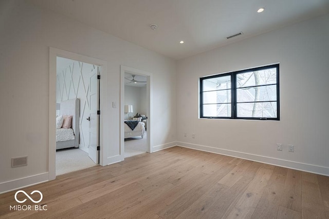 395 Breakwater Dr, Fishers, IN 46037 - unfurnished bedroom featuring visible vents, baseboards, light wood-style floors, and recessed lighting