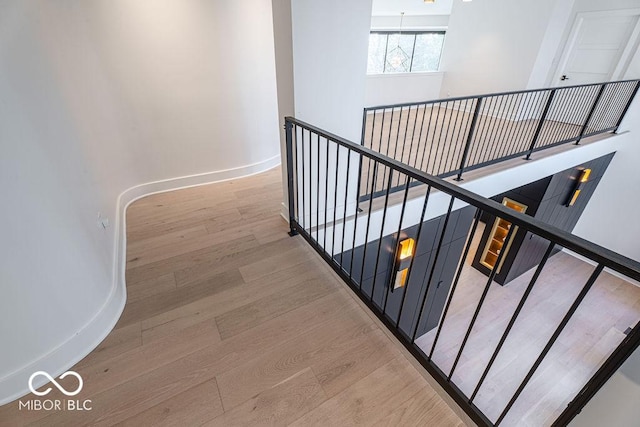 395 Breakwater Dr, Fishers, IN 46037 - staircase with baseboards and wood finished floors