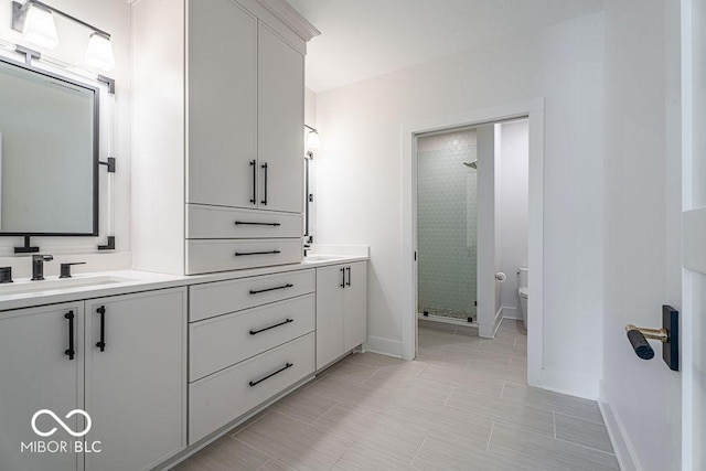 395 Breakwater Dr, Fishers, IN 46037 - full bath featuring a shower stall, a sink, toilet, and double vanity