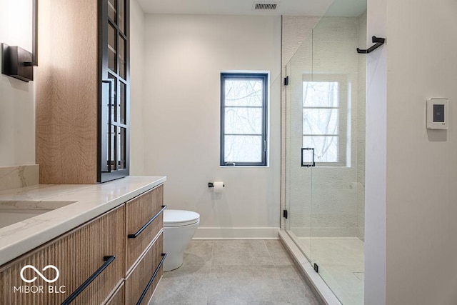 395 Breakwater Dr, Fishers, IN 46037 - bathroom featuring tile patterned flooring, vanity, toilet, baseboards, and a stall shower