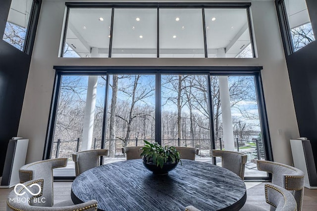 395 Breakwater Dr, Fishers, IN 46037 - dining area featuring wood finished floors and a towering ceiling