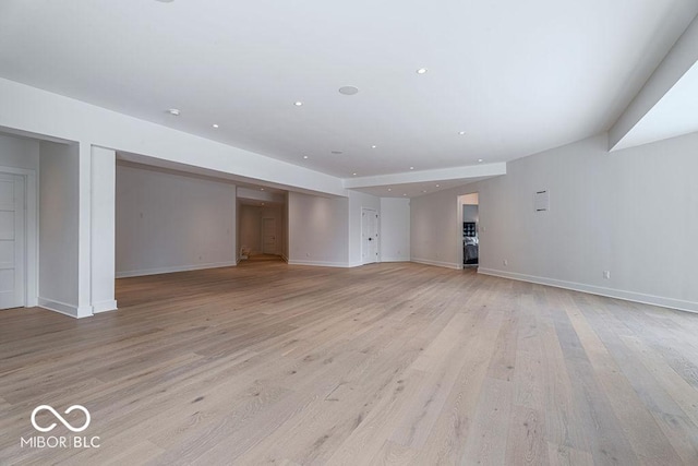 395 Breakwater Dr, Fishers, IN 46037 - unfurnished living room with recessed lighting, baseboards, and light wood-type flooring