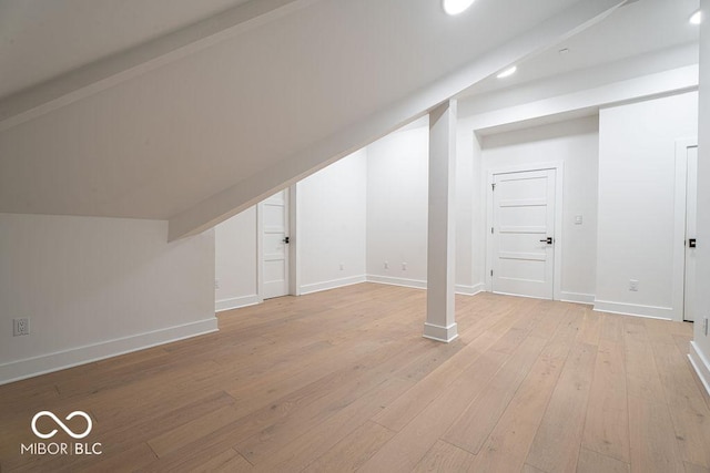 395 Breakwater Dr, Fishers, IN 46037 - bonus room featuring baseboards, vaulted ceiling, and light wood finished floors