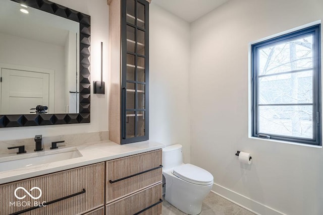 395 Breakwater Dr, Fishers, IN 46037 - half bath with baseboards, toilet, and vanity