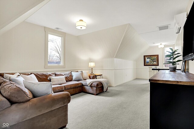 450 W Ash St, Zionsville, IN 46077 - living area featuring visible vents, vaulted ceiling, and carpet floors