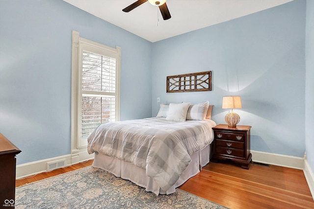 450 W Ash St, Zionsville, IN 46077 - bedroom featuring ceiling fan, visible vents, baseboards, and wood finished floors