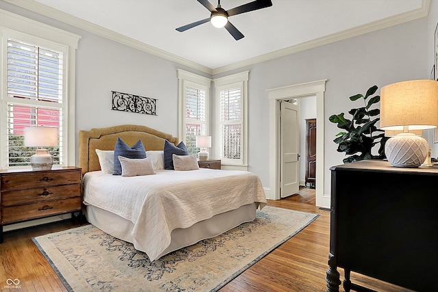 450 W Ash St, Zionsville, IN 46077 - bedroom featuring baseboards, hardwood / wood-style flooring, crown molding, and ceiling fan
