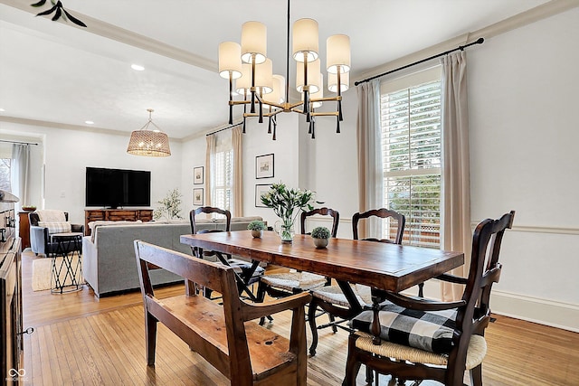 450 W Ash St, Zionsville, IN 46077 - dining area featuring recessed lighting, a notable chandelier, light wood-style flooring, and a healthy amount of sunlight