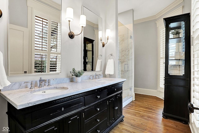 450 W Ash St, Zionsville, IN 46077 - full bathroom with a sink, baseboards, a shower stall, and wood finished floors