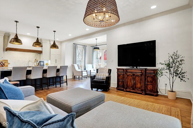 450 W Ash St, Zionsville, IN 46077 - living room with a chandelier, light wood-type flooring, baseboards, and recessed lighting