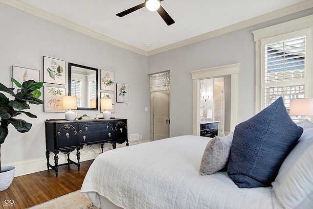 450 W Ash St, Zionsville, IN 46077 - bedroom featuring visible vents, baseboards, ceiling fan, crown molding, and wood finished floors