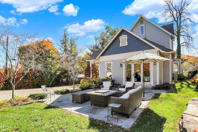 450 W Ash St, Zionsville, IN 46077 - rear view of property with a patio, french doors, an outdoor hangout area, and a yard