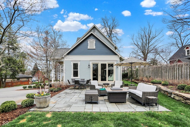 450 W Ash St, Zionsville, IN 46077 - back of house featuring a patio area, outdoor lounge area, fence, and a lawn