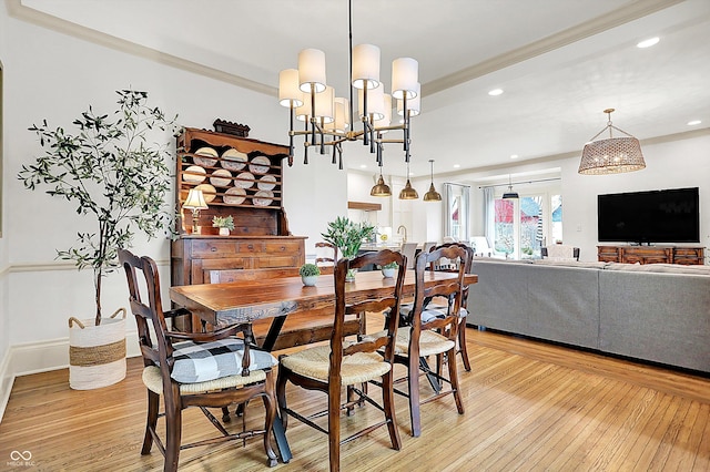 450 W Ash St, Zionsville, IN 46077 - dining space with light wood-type flooring, an inviting chandelier, and recessed lighting