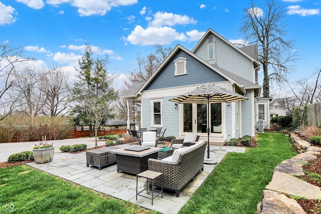 450 W Ash St, Zionsville, IN 46077 - back of house featuring a lawn, fence, a patio, an outdoor hangout area, and roof with shingles