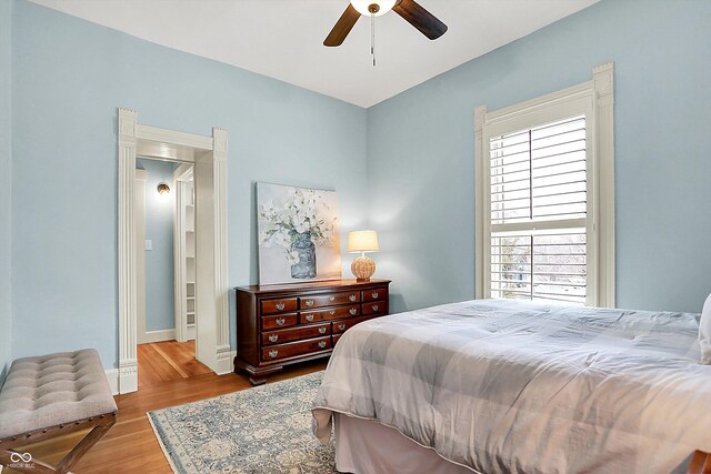 450 W Ash St, Zionsville, IN 46077 - bedroom featuring baseboards, ceiling fan, and wood finished floors