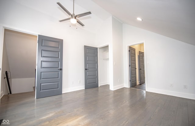 unfurnished bedroom with recessed lighting, baseboards, vaulted ceiling, and wood finished floors