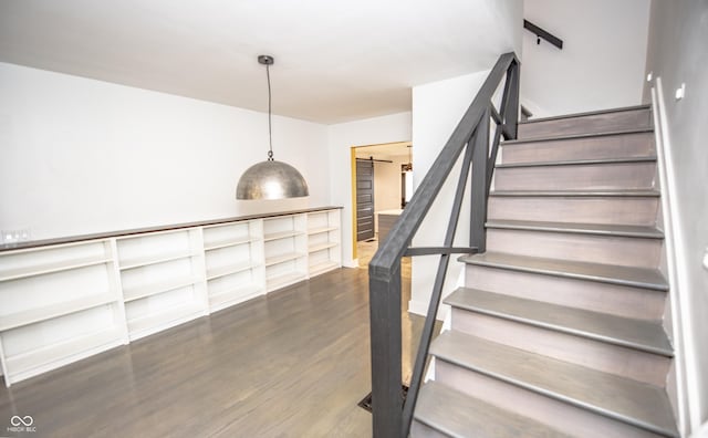 staircase with wood finished floors