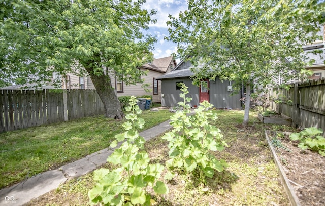 615 E Morris St, Indianapolis, IN 46203 - view of yard with a vegetable garden and an outbuilding