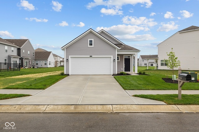 view of front of house featuring driveway, a front yard, a garage, and a residential view
