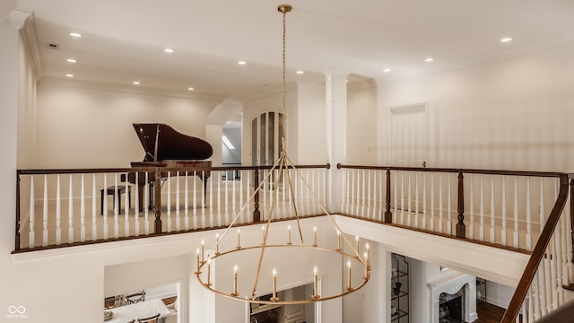 hallway with ornamental molding and recessed lighting