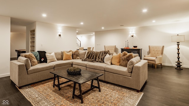 living area featuring stairs, recessed lighting, dark wood-style floors, and baseboards