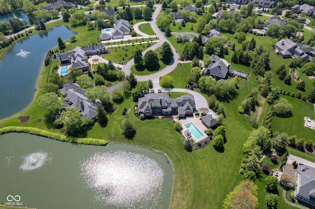 aerial perspective of suburban area with a nearby body of water